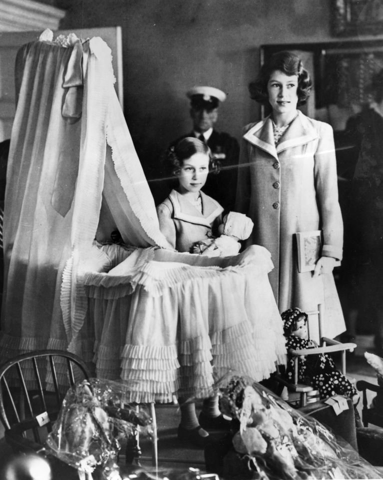 The future Queen and Princess Margaret in one of the two nurseries which had toys from all over the Commonwealth