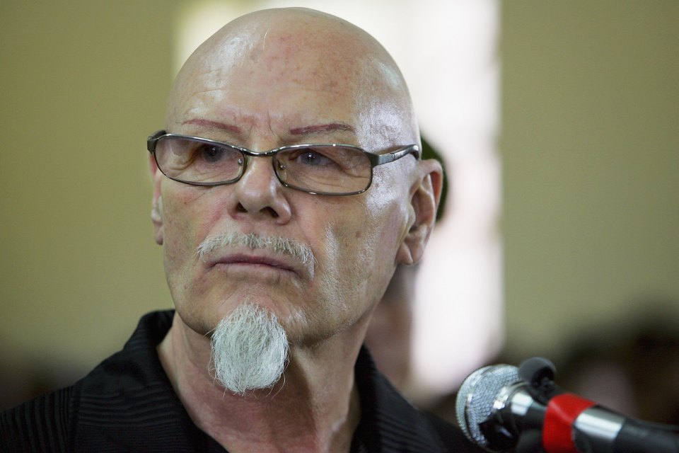 Police were called at Gary Glitter's bail hostel after vigilantes climbed gates and stormed the grounds