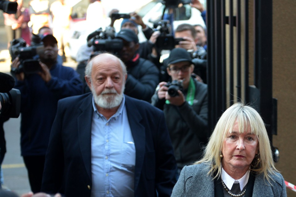 Reeva Steenkamp's dad Barry and mum June (C) arrive at the Northern Gauteng High Court in 2016