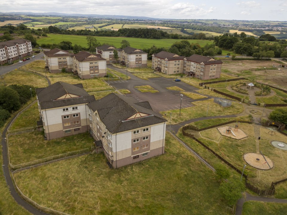 An aerial shot shows the now empty, eerie 128 flats surrounding Nick