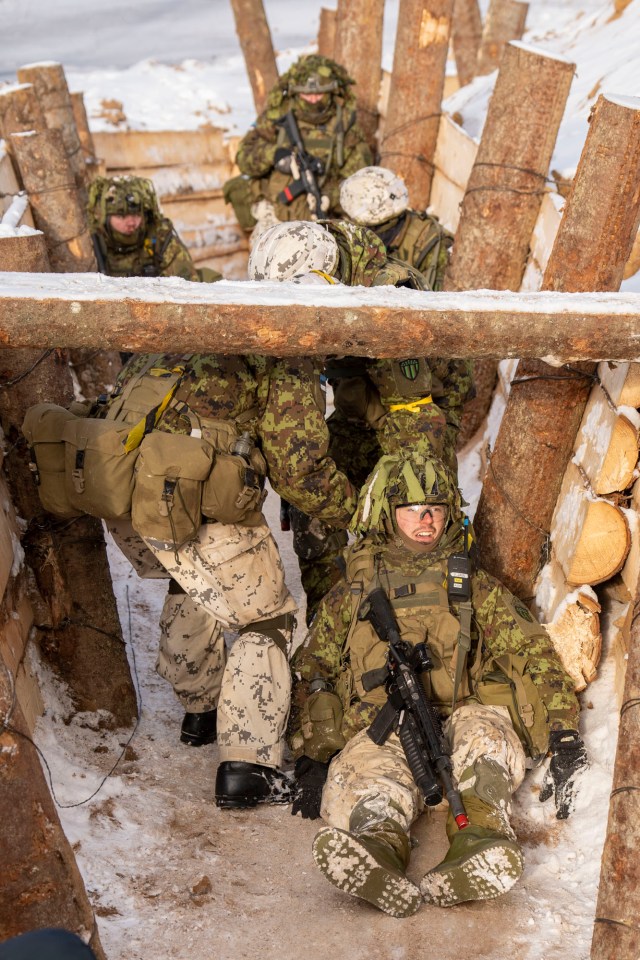 Troops also reenacted carrying 'casualties' through the trenches to safety