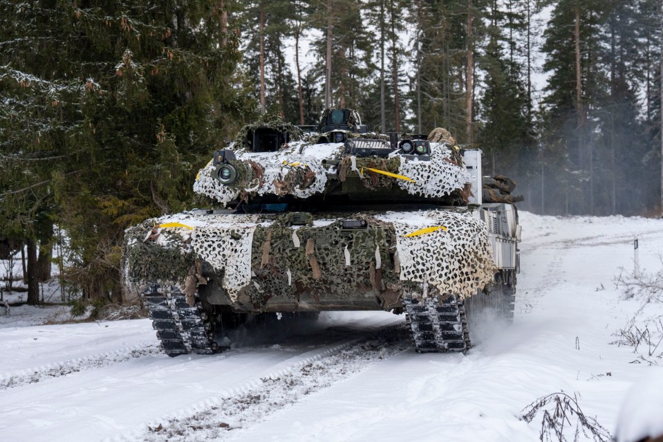 A Danish Leopard 2A7 Tank rumbles through the forest