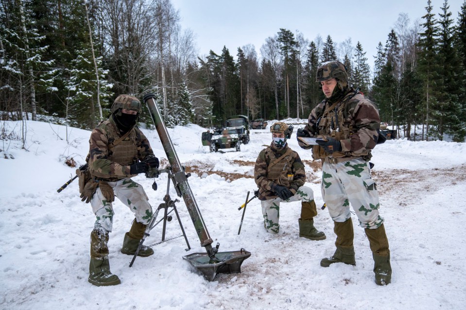 Soldiers set up a mortar during the war games