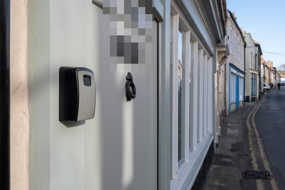 The area is filled with key lockboxes, which are typically used for rental and Airbnb properties