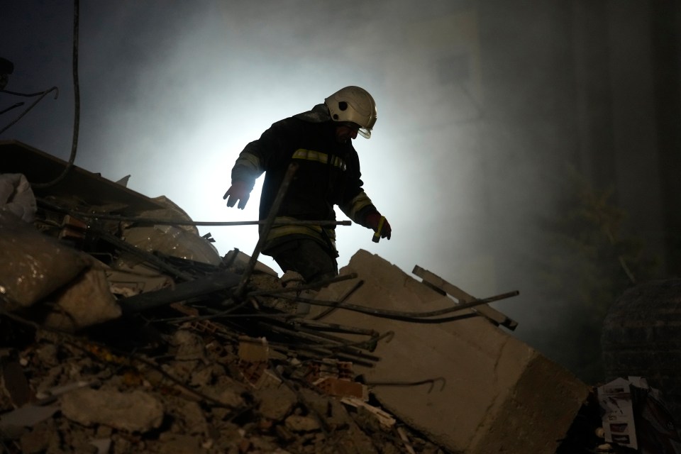 A firefighter scouring the wreckage for any signs of survivors in Gaziantep