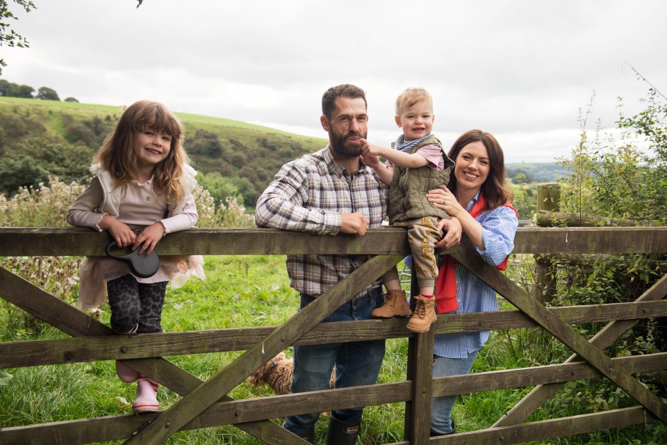 Liz and Kelvin with Milo and Marnie on the farm