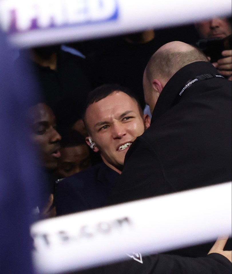 The former IBF featherweight champ had to be held back by security after being spat on