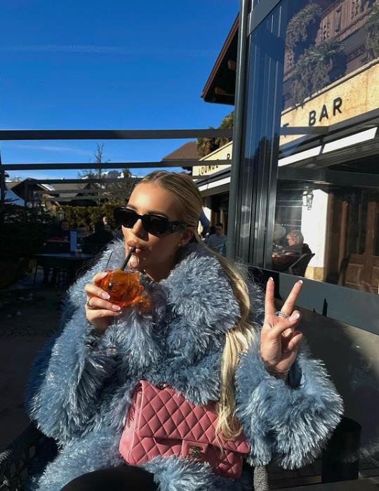 Mary tucked into an Aperol spritz at lunch