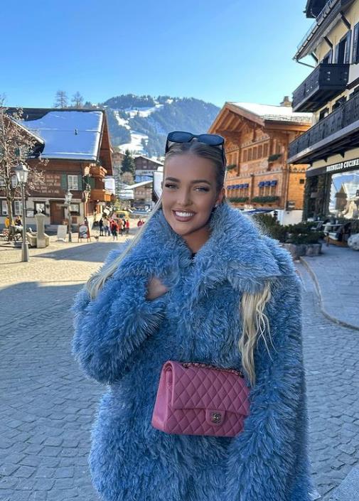 The blonde beauty headed into town in a gorgeous blue coat