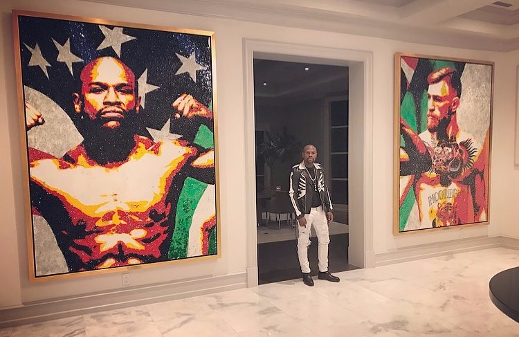 Mayweather celebrates his biggest pay day with artwork of himself and foe Conor McGregor