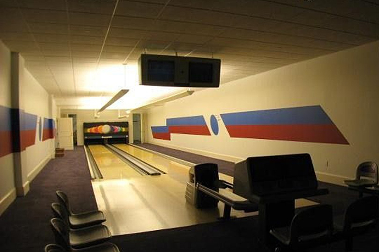 An unnecessary bowling alley is one of the home's many features