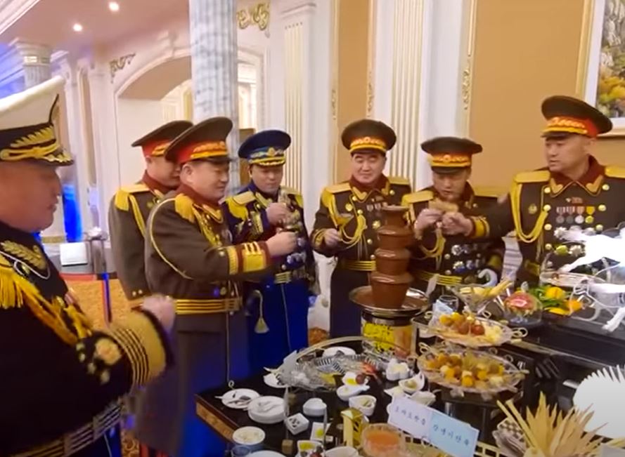 Kim's military elites seen toasting in front of a chocolate fountain