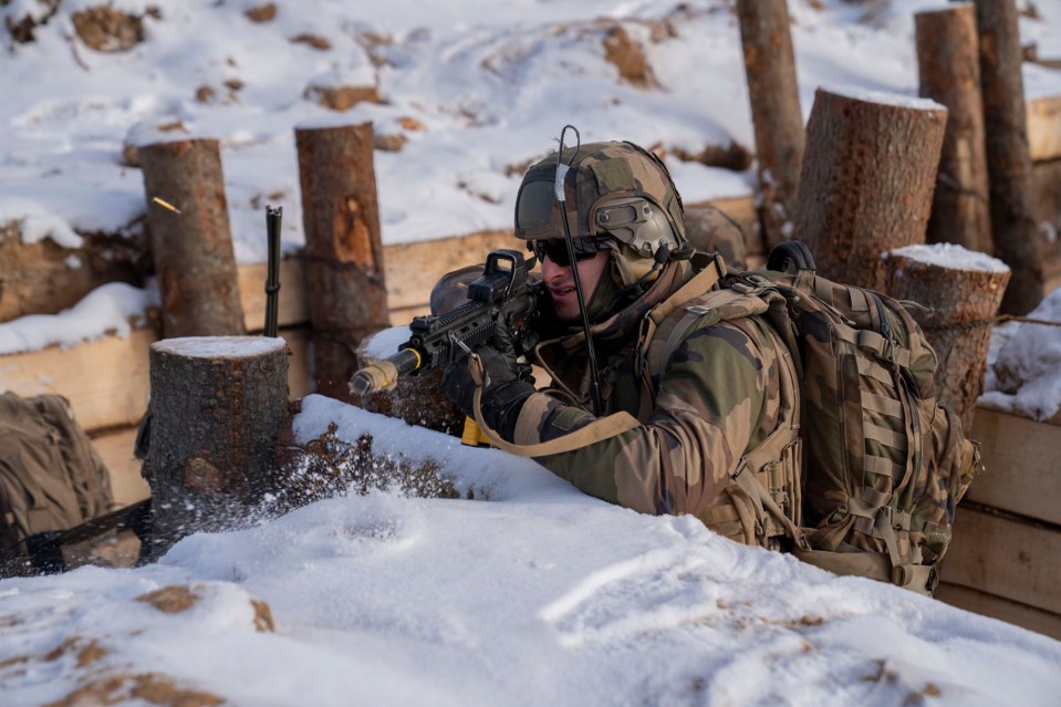 A soldier opens fire inside the trenches which stretch for half a mile