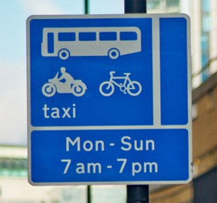 Bus lane signs are in blue - but you mest check that it has the motorbike symbol before using one