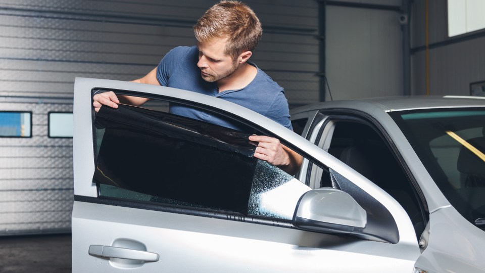 Tinting your back windows won't let you in trouble but if your windscreen and side mirrors are heavily tinted you could land yourself a fine