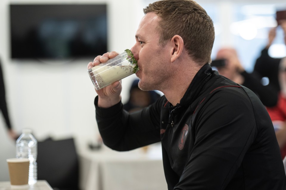 Dean Holden starts downing a glass of  blended mealworms