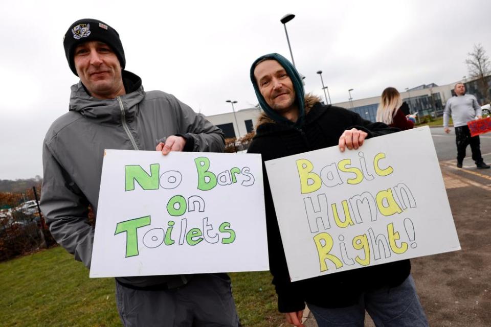 These local dads borrowed their kids' highlighters to make some snazzy placards