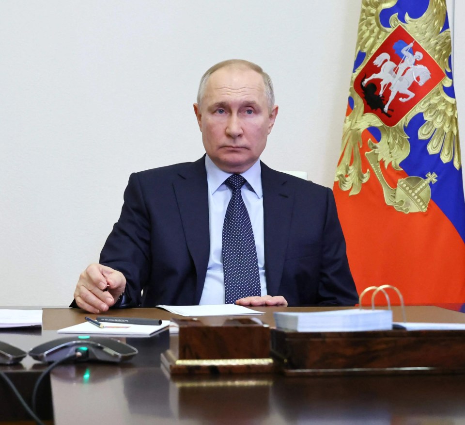 Vladimir Putin looks grim on a recent video conference