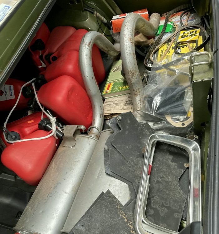 Spare parts for the vehicle, petrol storage containers and a Haynes manual were found on the boot