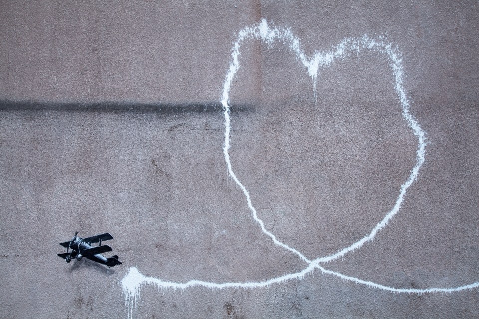 Love Plane depicts a biplane drawing a heart with its trail