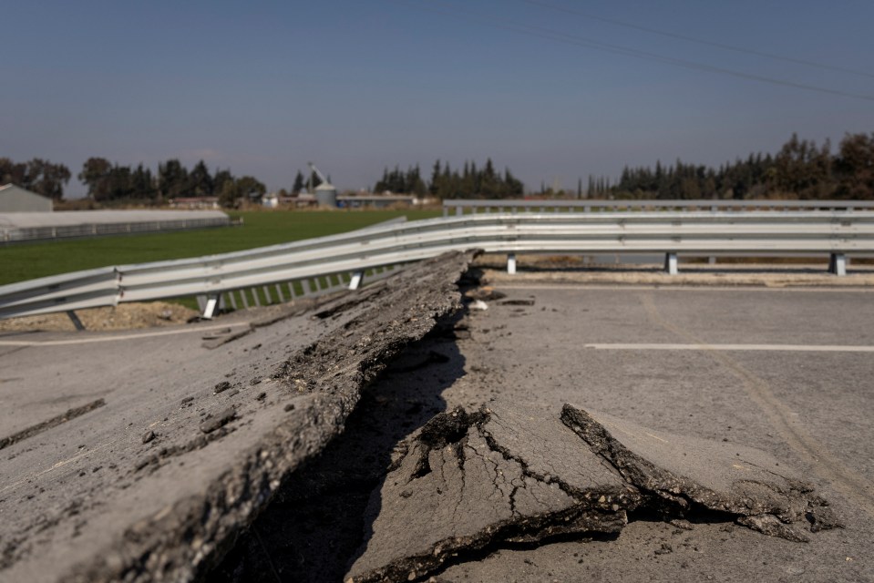 The force of the quake created gaping cracks in roads