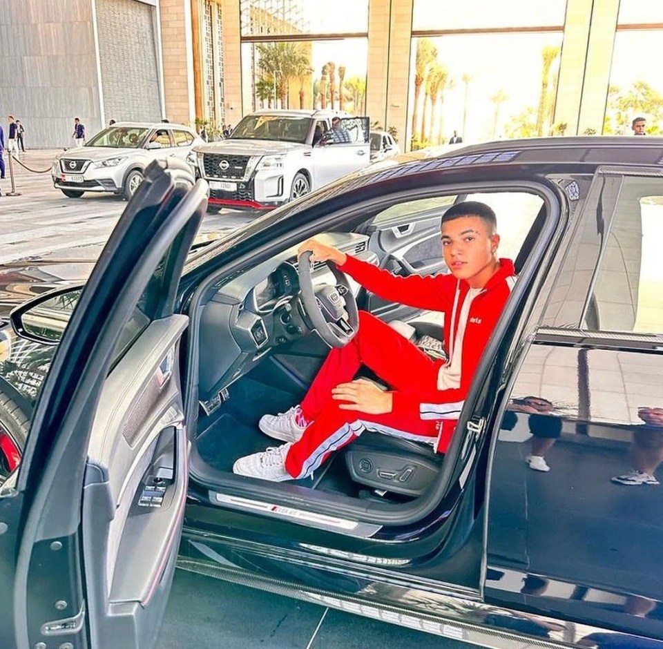 He shared a picture of himself posing in a luxury motor