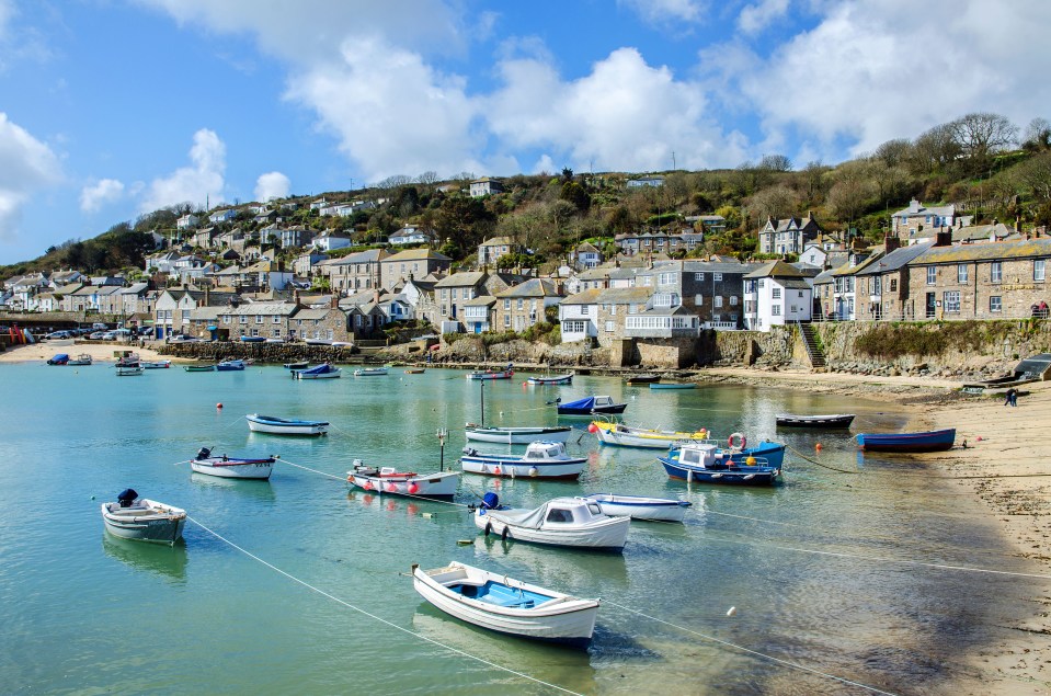 Boats moored in the harbour at Mousehole, Cornwall