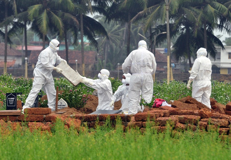 A victim of the brain-damanging Nipah virus is buried in Kerala, India