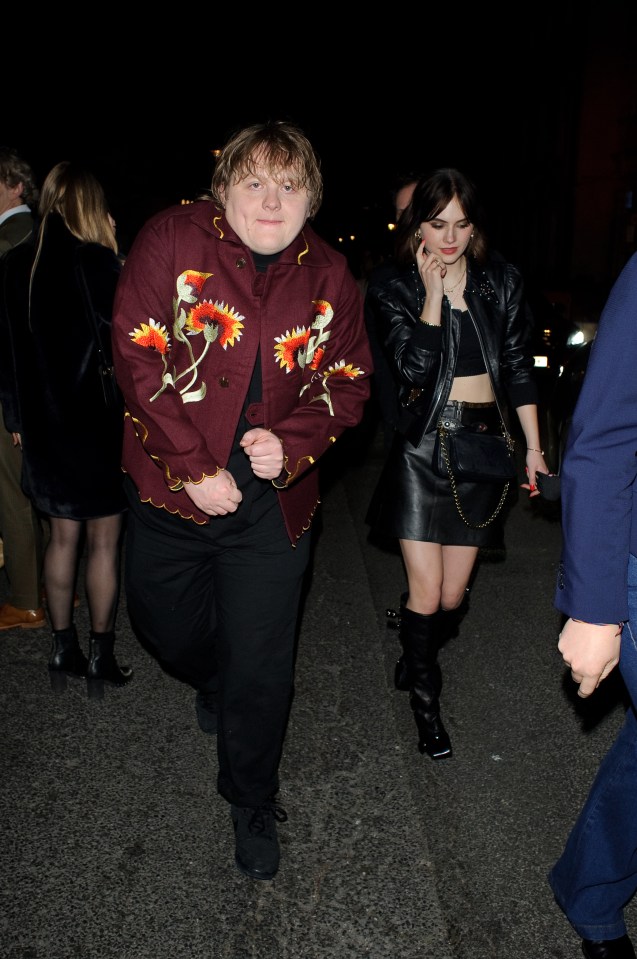 Lewis is seen outside the party on The Strand in central London