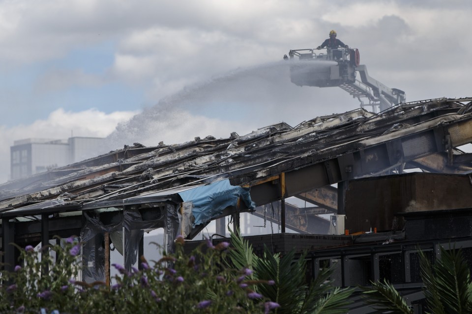 Fire crews work to extinguish the fire at the Studio 338 nightclub