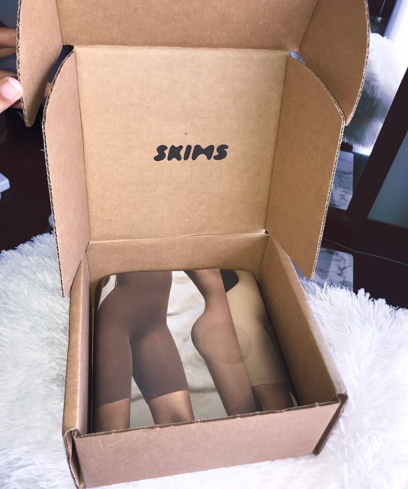 Skims packaging featuring signature bodysuits.