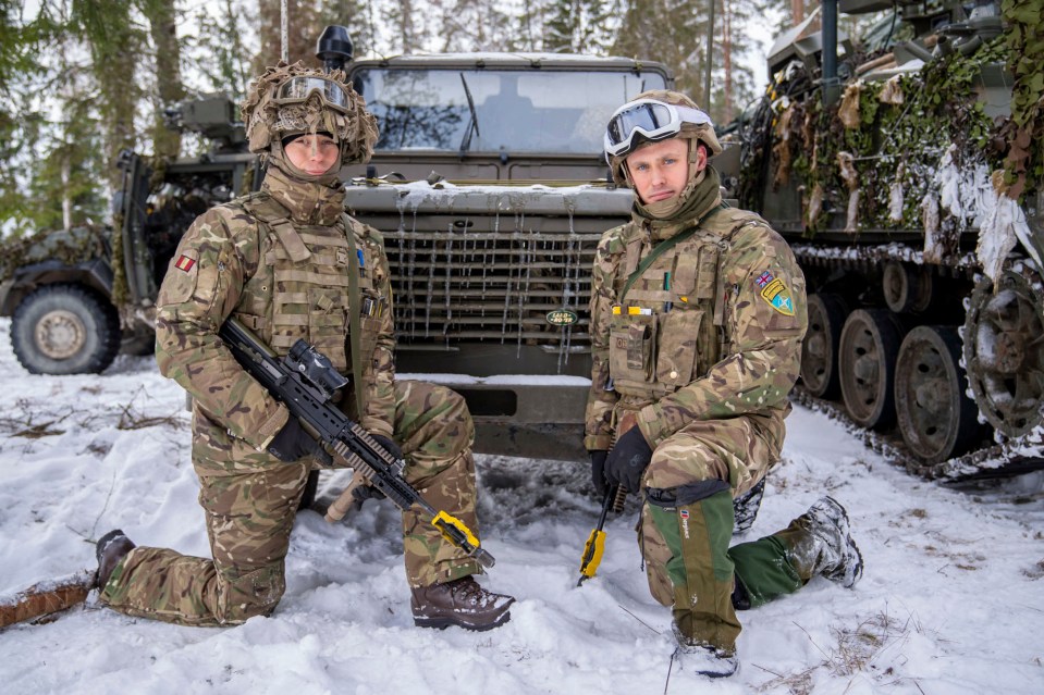 The squaddies pose alongside some of their tanks and trucks