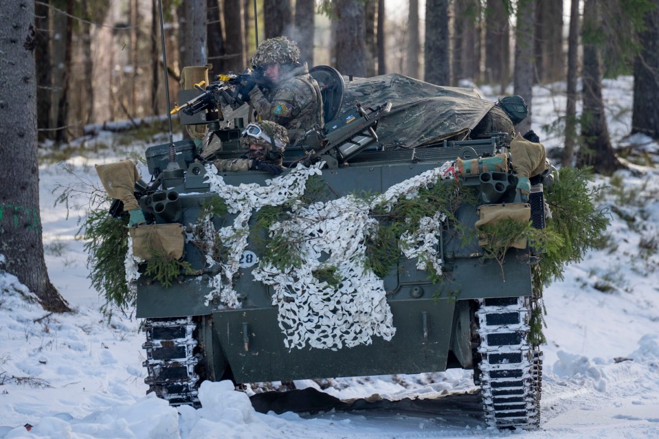 A team of British Royal engineers practise firing from tanks during the drill