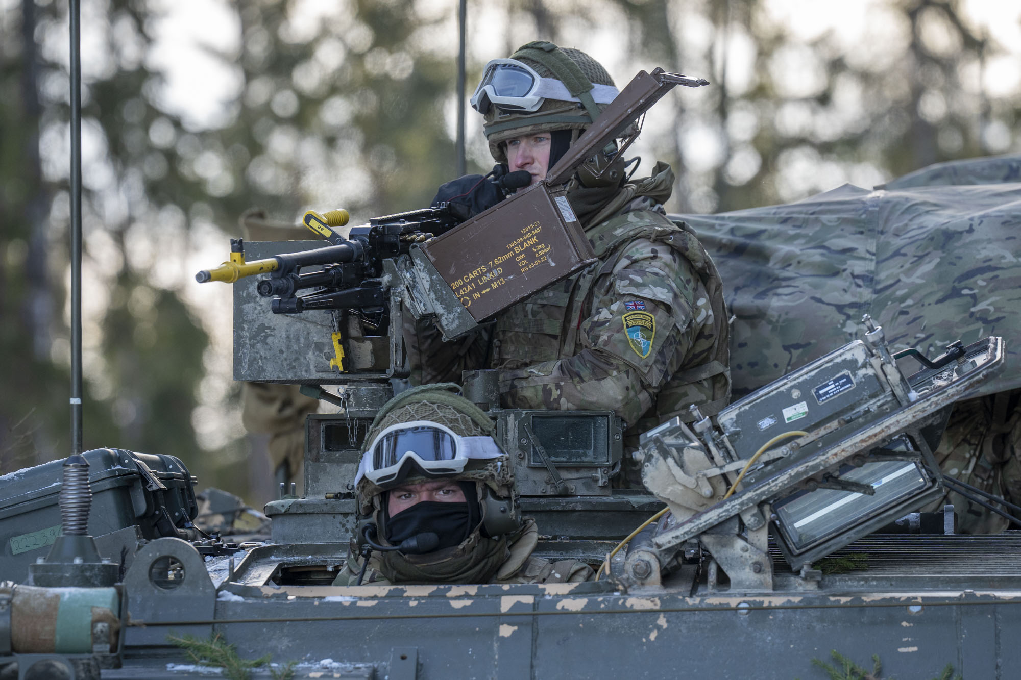 British Royal Engineers atop a tank during the exercise