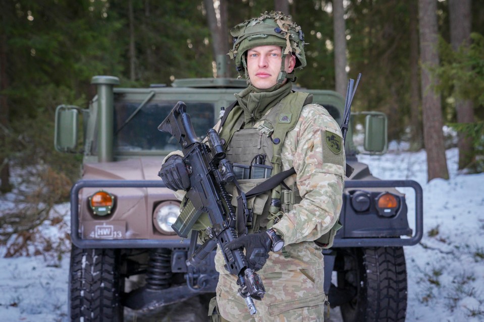 Another soldier stands by a humvee during the drills