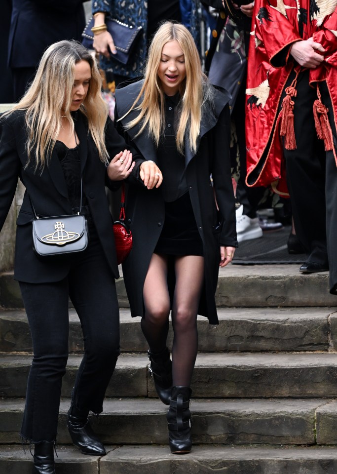 Kate Moss's daughter Lila Grace Moss paired her outfit with a Westwood red bag