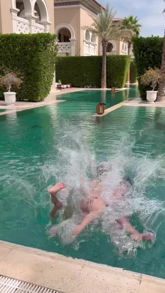 The kids collapses into a pool with their mum