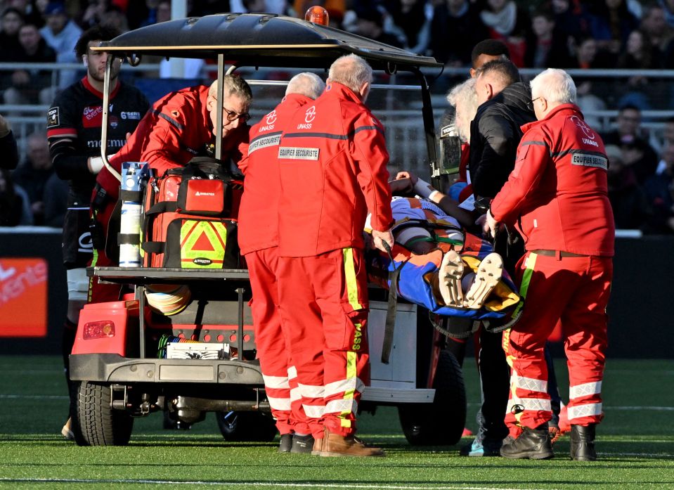 Zach Mercer is stretchered off against Lyon