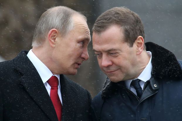 Dmitry Medvedev, a prolific mouthpiece for the Russian propaganda machine, with despot Vladimir Putin