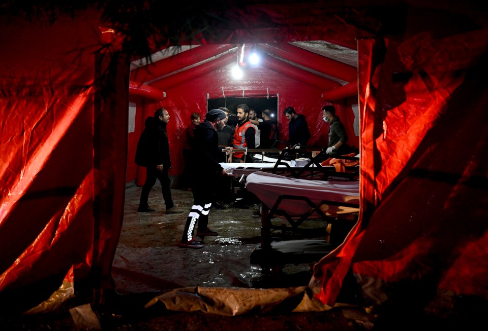 Medics set up an emergency field hospital for the patients of the Iskenderun State Hospital who were evacuated from the building