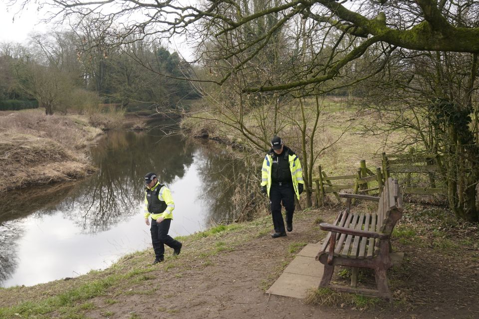 Cop activity near the bench where the mum's phone was found