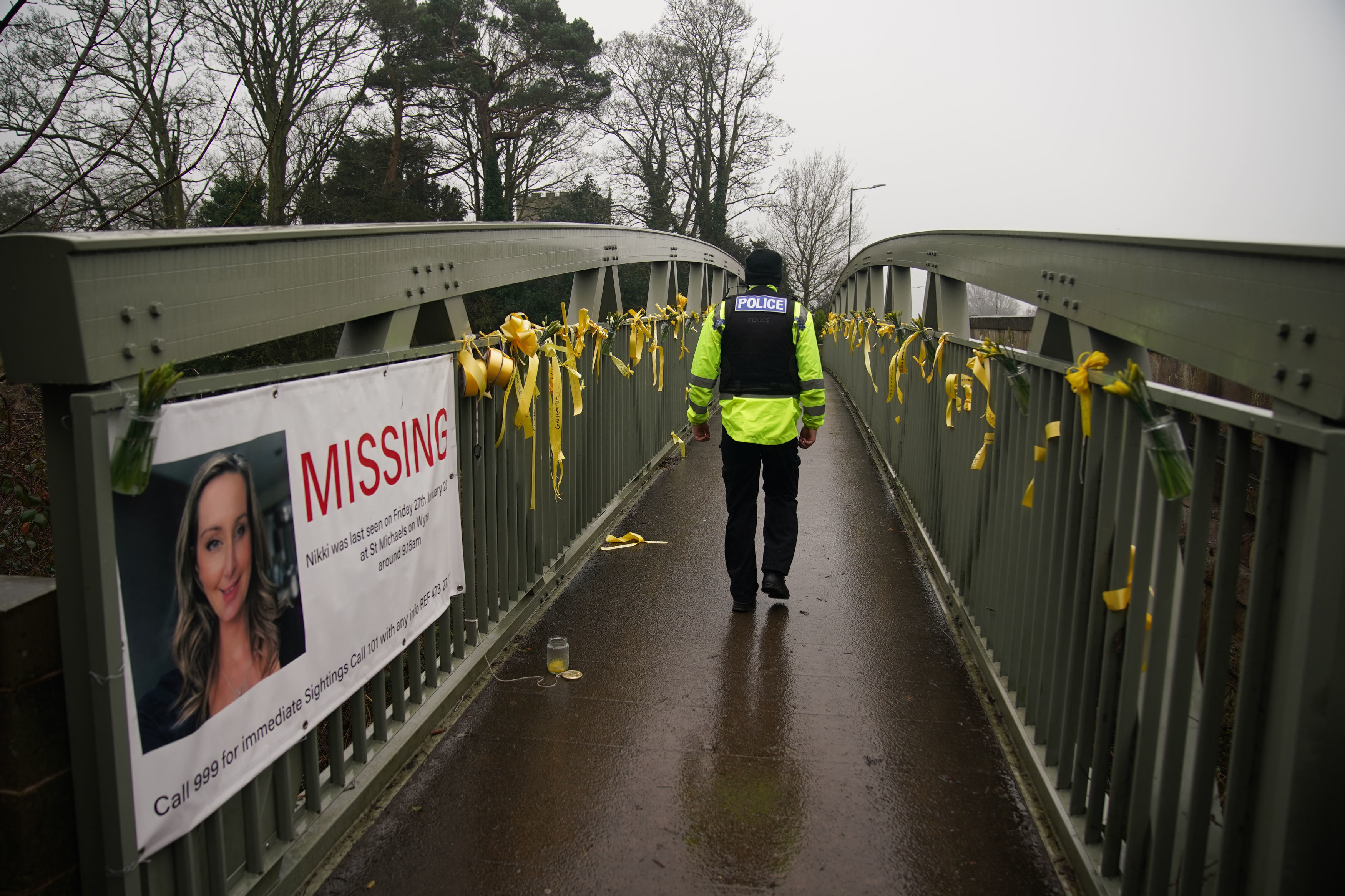 Family and members of the public have been placing yellow ribbons with messages on the bridge near where Nicola disappeared