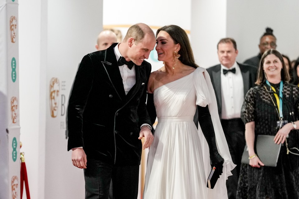 The Prince and Princess of Wales were seen whispering and giggling on the Baftas red carpet