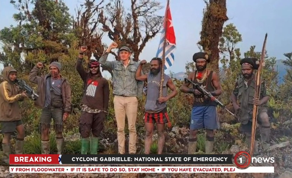 A photo shows Philip with the rebels who kidnapped him