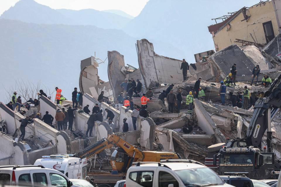 The grim search for bodies continues in the rubble