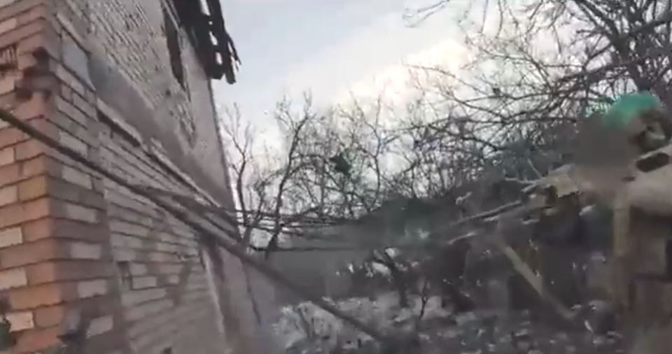 A Ukrainian soldier firing on Russian positions