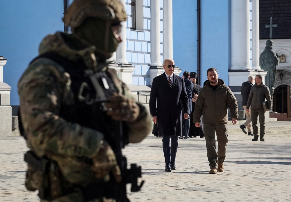 Biden and Zelensky walk through Kyiv as a soldier stands guard