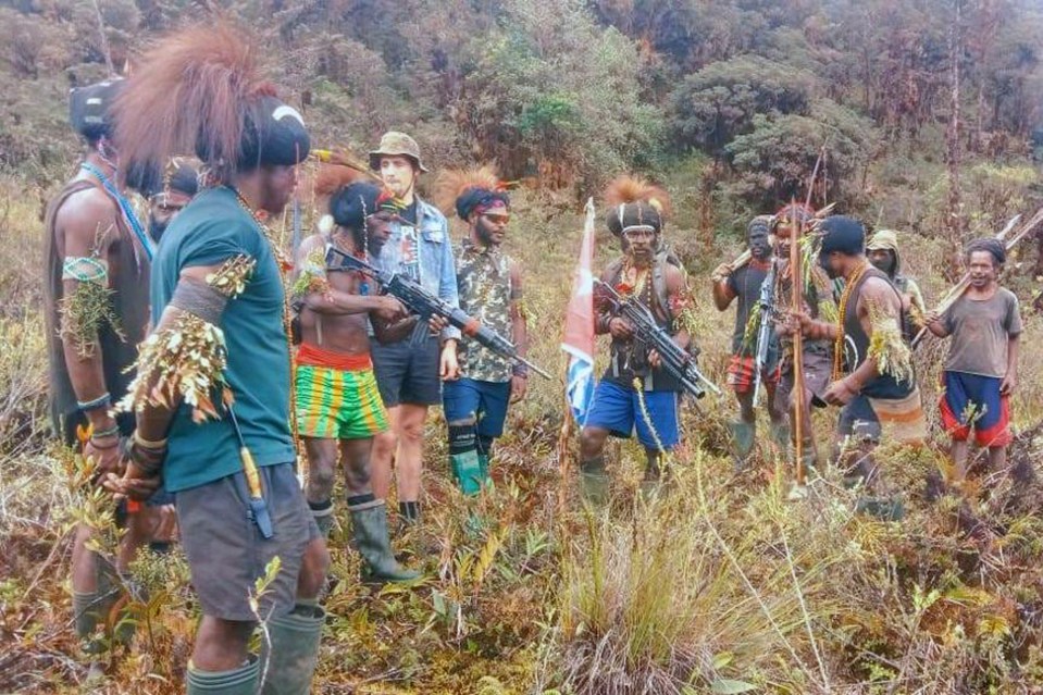 Philip can be seen among the group of Papau rebels