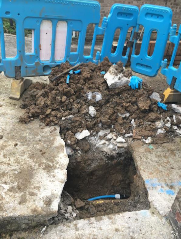 The issue resulted in large holes being dug outside her property to identify the cause of the leak