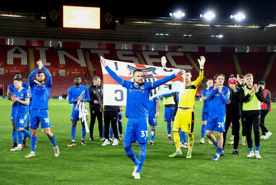 Grimsby Town celebrate their victory over Southampton in the FA Cup